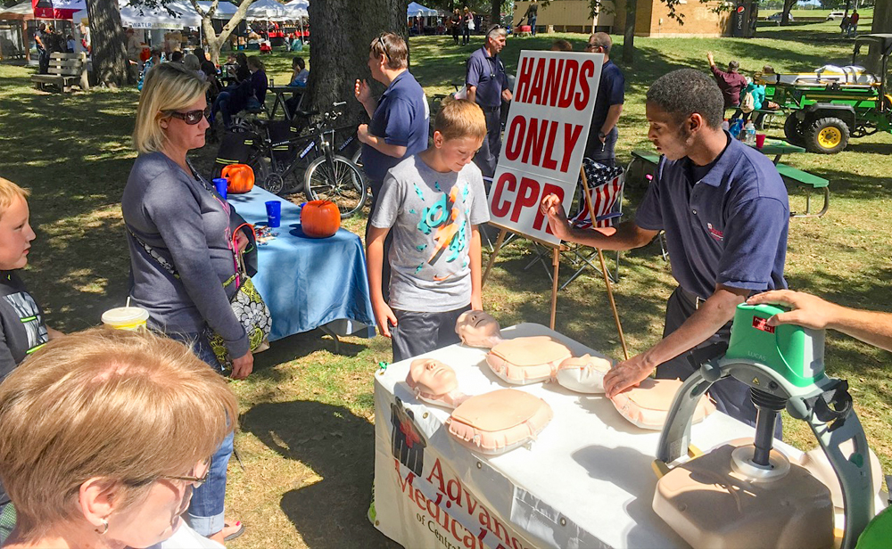 outside table display showing hands only cpr